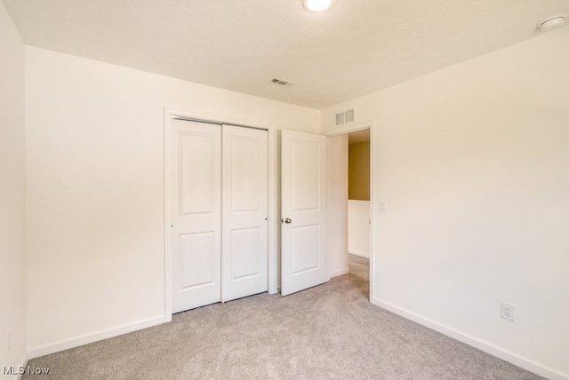 677 Crossings Ln, Akron, OH 44320 - unfurnished bedroom with light colored carpet and a closet