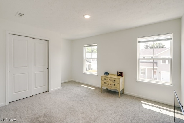 677 Crossings Ln, Akron, OH 44320 - carpeted bedroom featuring baseboards and a closet