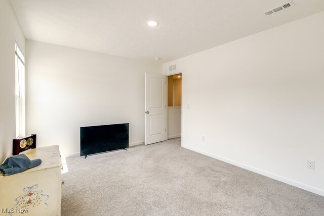 677 Crossings Ln, Akron, OH 44320 - unfurnished bedroom featuring light colored carpet and recessed lighting