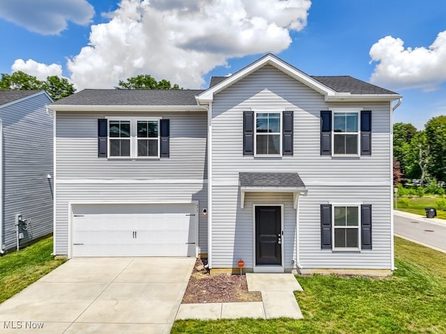 677 Crossings Ln, Akron, OH 44320 - traditional home featuring driveway, a garage, a front yard, and roof with shingles