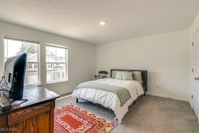 677 Crossings Ln, Akron, OH 44320 - bedroom with light colored carpet, a textured ceiling, and recessed lighting