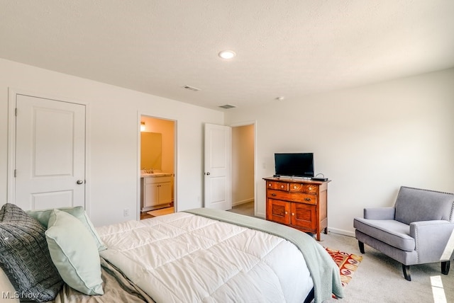 677 Crossings Ln, Akron, OH 44320 - bedroom with light carpet, recessed lighting, and ensuite bath