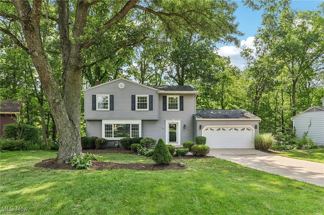 2331 Woodpark Rd, Fairlawn, OH 44333 - view of front of house with concrete driveway, an attached garage, and a front lawn