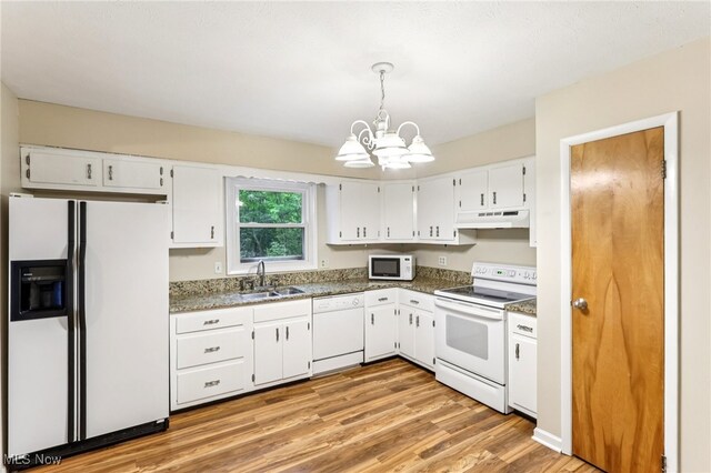 2331 Woodpark Rd, Fairlawn, OH 44333 - kitchen with white appliances, under cabinet range hood, a chandelier, white cabinetry, and light wood-style flooring
