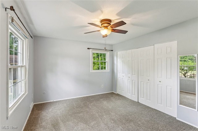 2331 Woodpark Rd, Fairlawn, OH 44333 - unfurnished bedroom featuring carpet floors, a closet, and a ceiling fan