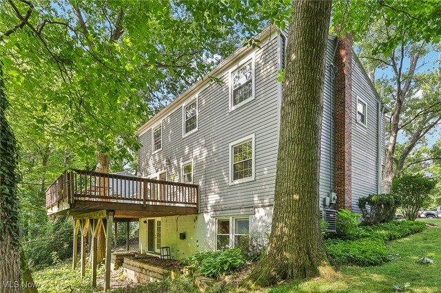 2331 Woodpark Rd, Fairlawn, OH 44333 - rear view of property with a wooden deck and a chimney
