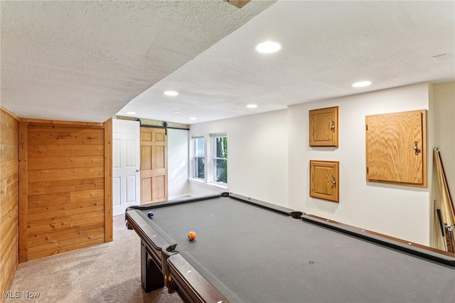 2331 Woodpark Rd, Fairlawn, OH 44333 - game room featuring a barn door, a textured ceiling, carpet, recessed lighting, and wooden walls