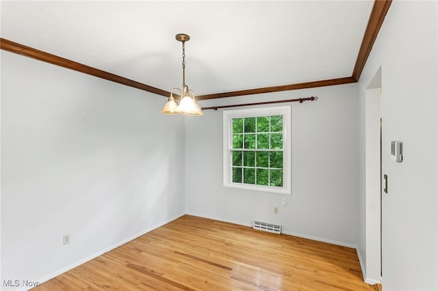2331 Woodpark Rd, Fairlawn, OH 44333 - unfurnished room featuring ornamental molding, a chandelier, and light wood-type flooring