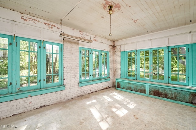 74 Maplewood Ave, Akron, OH 44313 - unfurnished sunroom with french doors, wooden ceiling, and brick wall