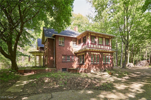 74 Maplewood Ave, Akron, OH 44313 - back of property with brick siding and a chimney