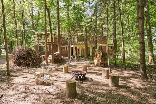 74 Maplewood Ave, Akron, OH 44313 - view of yard with an outdoor fire pit and a wooded view