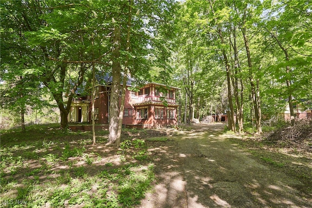 74 Maplewood Ave, Akron, OH 44313 - view of yard with a balcony and a view of trees