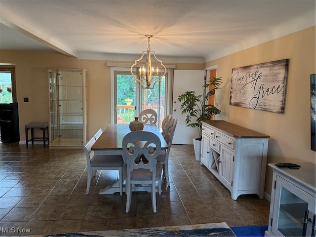 9237 Shephard Rd, Macedonia, OH 44056 - dining space with plenty of natural light, a chandelier, and dark tile patterned flooring