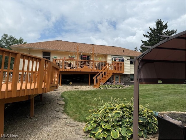 9237 Shephard Rd, Macedonia, OH 44056 - back of house with a deck, stairs, a lawn, and roof with shingles