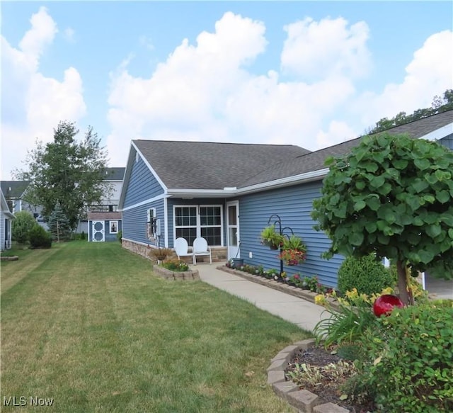 723 Whisper Creek Ln, Lodi, OH 44254 - back of property featuring a lawn and roof with shingles