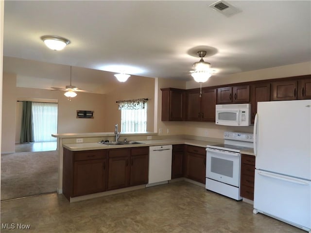 723 Whisper Creek Ln, Lodi, OH 44254 - kitchen with white appliances, healthy amount of natural light, a ceiling fan, and a peninsula