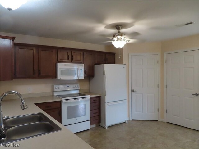 723 Whisper Creek Ln, Lodi, OH 44254 - kitchen with white appliances, ceiling fan, light flooring, and light countertops