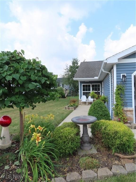 723 Whisper Creek Ln, Lodi, OH 44254 - view of grassy yard with a patio area