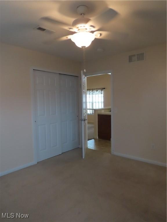 723 Whisper Creek Ln, Lodi, OH 44254 - unfurnished bedroom with a closet and a ceiling fan