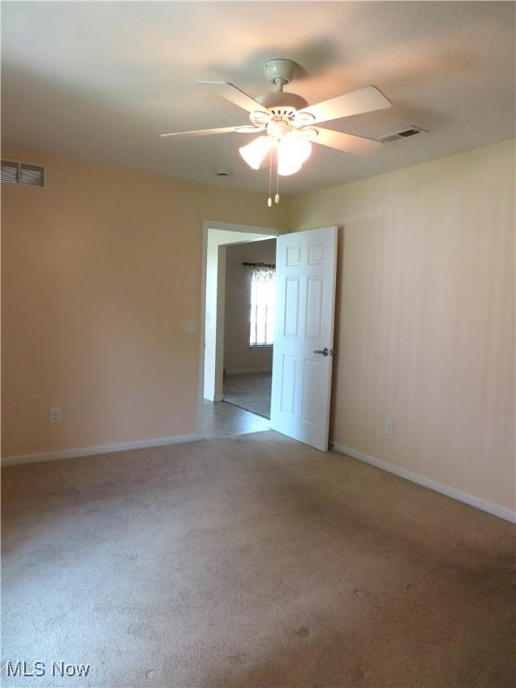 723 Whisper Creek Ln, Lodi, OH 44254 - spare room featuring a ceiling fan and carpet