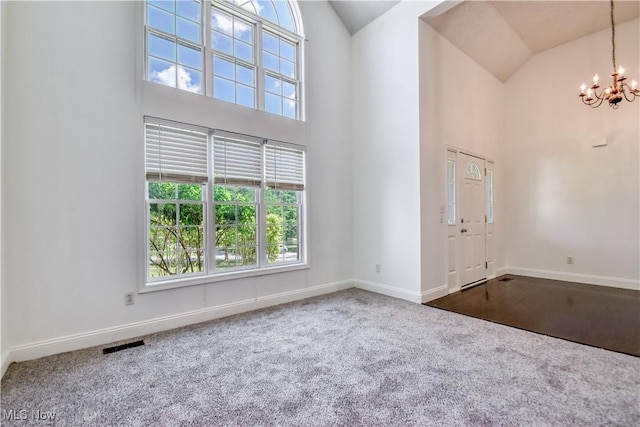 9798 Firestone Ln, Macedonia, OH 44056 - entrance foyer with high vaulted ceiling, a chandelier, and carpet floors