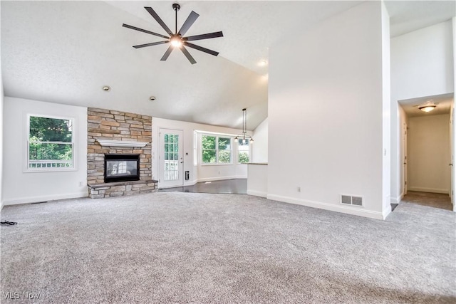 9798 Firestone Ln, Macedonia, OH 44056 - unfurnished living room featuring carpet floors, ceiling fan, a fireplace, and high vaulted ceiling