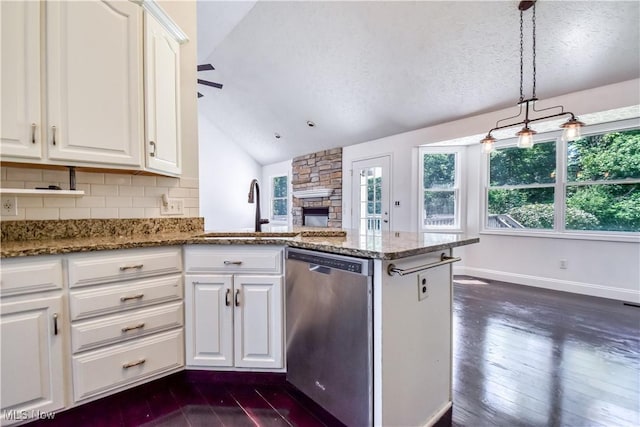 9798 Firestone Ln, Macedonia, OH 44056 - kitchen with dishwasher, dark wood-style floors, lofted ceiling, and white cabinets