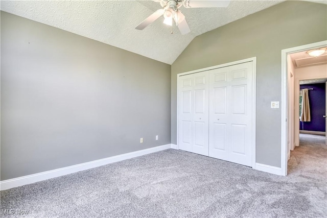 9798 Firestone Ln, Macedonia, OH 44056 - unfurnished bedroom with carpet, vaulted ceiling, a textured ceiling, a closet, and ceiling fan