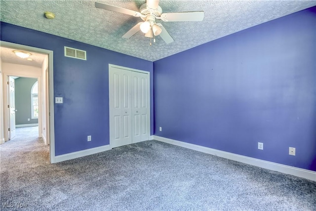 9798 Firestone Ln, Macedonia, OH 44056 - unfurnished bedroom with carpet, a closet, a textured ceiling, and a ceiling fan