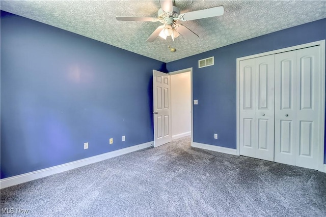 9798 Firestone Ln, Macedonia, OH 44056 - unfurnished bedroom featuring carpet flooring, a closet, a textured ceiling, and a ceiling fan