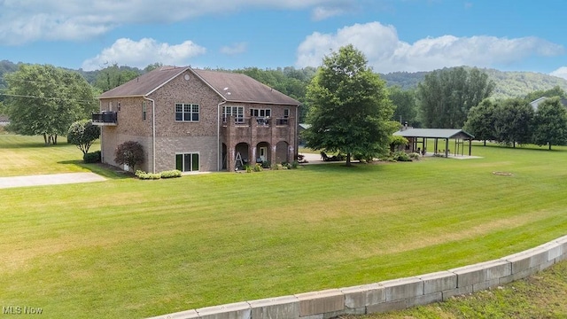 390 Powell Riverfront Rd, Saint Marys, WV 26170 - back of house featuring brick siding, a yard, and a gazebo