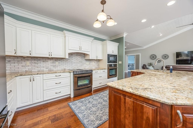 390 Powell Riverfront Rd, Saint Marys, WV 26170 - kitchen with stainless steel appliances, wood finished floors, tasteful backsplash, white cabinetry, and ornamental molding