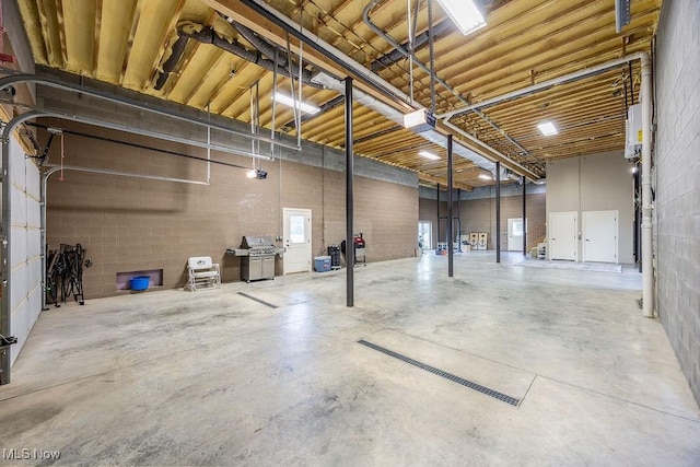 390 Powell Riverfront Rd, Saint Marys, WV 26170 - basement featuring a garage and concrete block wall