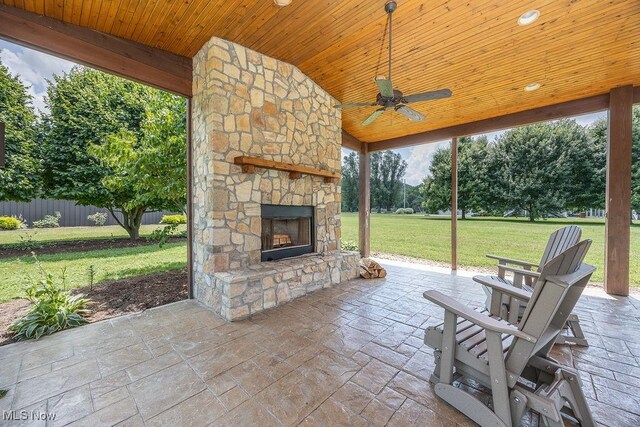 390 Powell Riverfront Rd, Saint Marys, WV 26170 - view of patio with an outdoor stone fireplace and a ceiling fan