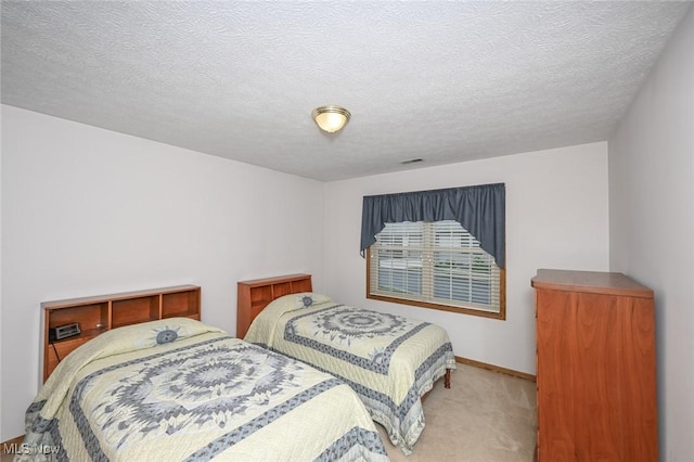 1412 Tewksbury Cir Unit 1C, Cuyahoga Falls, OH 44221 - carpeted bedroom featuring baseboards and a textured ceiling