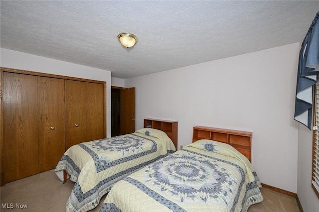 1412 Tewksbury Cir Unit 1C, Cuyahoga Falls, OH 44221 - carpeted bedroom with a closet and a textured ceiling