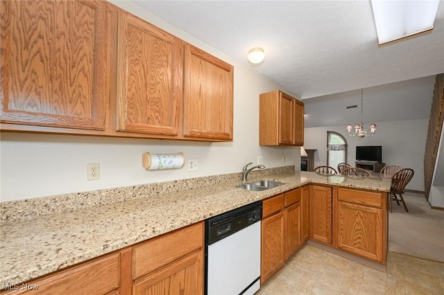 1412 Tewksbury Cir Unit 1C, Cuyahoga Falls, OH 44221 - kitchen featuring dishwasher, a peninsula, a chandelier, light stone counters, and brown cabinetry