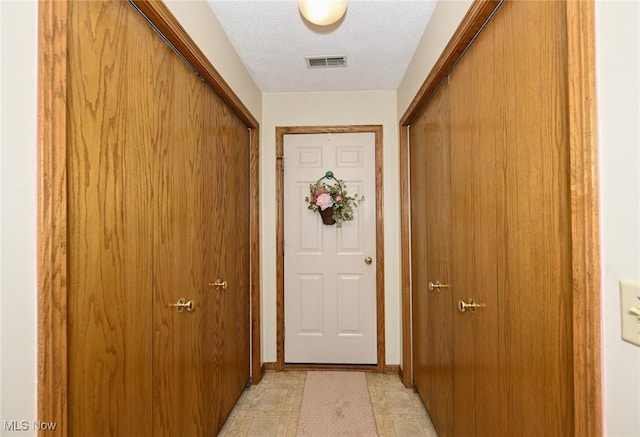 1412 Tewksbury Cir Unit 1C, Cuyahoga Falls, OH 44221 - entryway with a textured ceiling