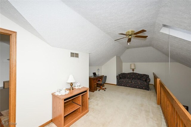 1412 Tewksbury Cir Unit 1C, Cuyahoga Falls, OH 44221 - bonus room featuring lofted ceiling, light carpet, ceiling fan, a textured ceiling, and a desk