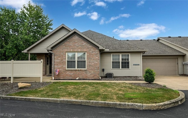 1412 Tewksbury Cir Unit 1C, Cuyahoga Falls, OH 44221 - ranch-style home with a garage, brick siding, driveway, and a shingled roof