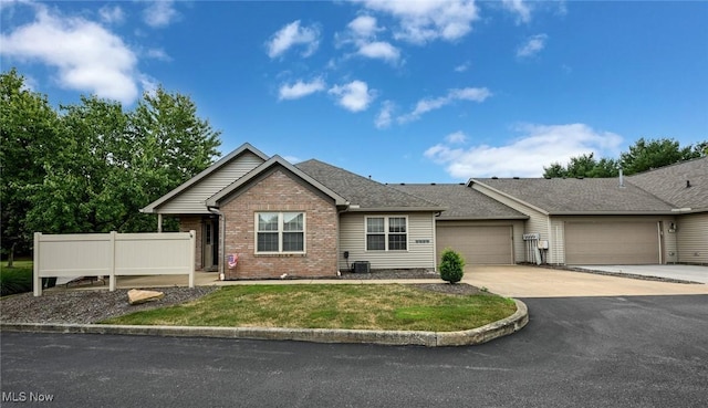 1412 Tewksbury Cir Unit 1C, Cuyahoga Falls, OH 44221 - single story home with brick siding, driveway, an attached garage, and roof with shingles