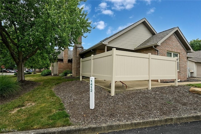 1412 Tewksbury Cir Unit 1C, Cuyahoga Falls, OH 44221 - view of home's exterior featuring brick siding