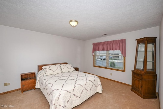 1412 Tewksbury Cir Unit 1C, Cuyahoga Falls, OH 44221 - bedroom with carpet flooring and a textured ceiling