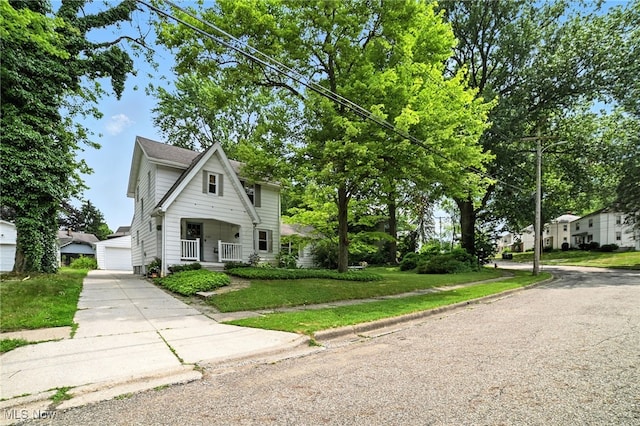 2107 13th St, Cuyahoga Falls, OH 44223 - view of front of home featuring a porch, a front yard, and a garage