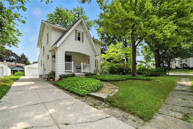 2107 13th St, Cuyahoga Falls, OH 44223 - view of front of home with a detached garage and a porch