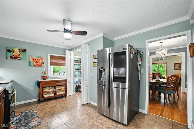 2107 13th St, Cuyahoga Falls, OH 44223 - kitchen with appliances with stainless steel finishes, a chandelier, a ceiling fan, crown molding, and tile patterned flooring