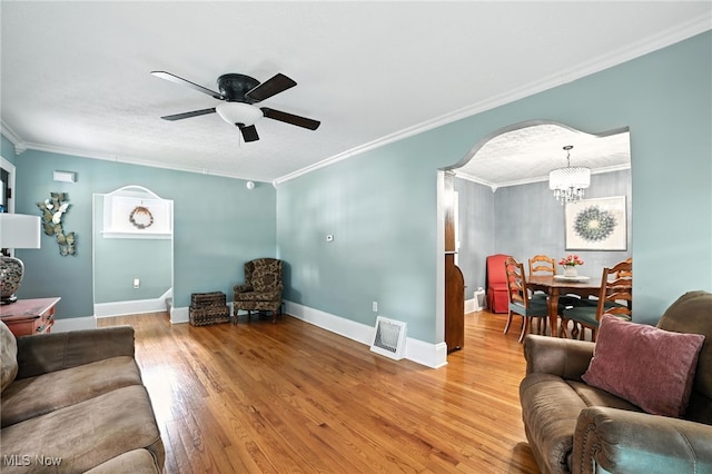 2107 13th St, Cuyahoga Falls, OH 44223 - living area with ceiling fan, wood finished floors, crown molding, and a chandelier