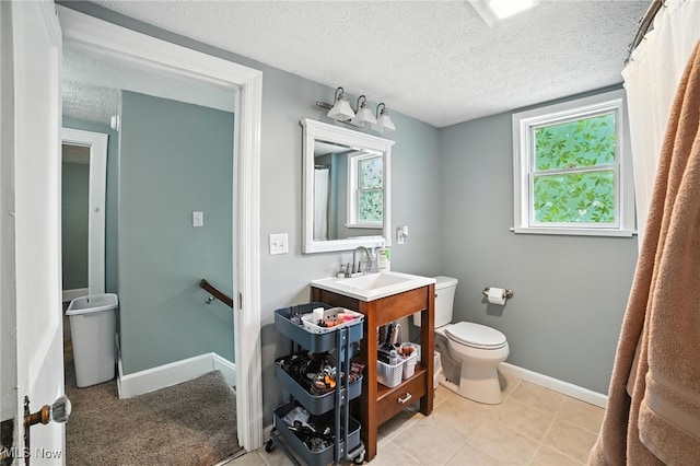 2107 13th St, Cuyahoga Falls, OH 44223 - full bathroom with vanity, a textured ceiling, and tile patterned floors