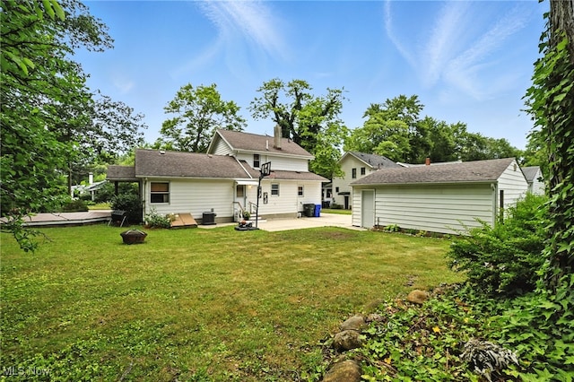 2107 13th St, Cuyahoga Falls, OH 44223 - back of property with a patio area and a lawn