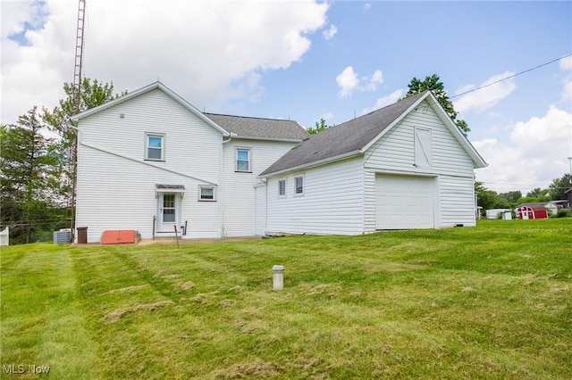 6248 Massillon Rd SW, Navarre, OH 44662 - rear view of house featuring a garage, a yard, and a shingled roof